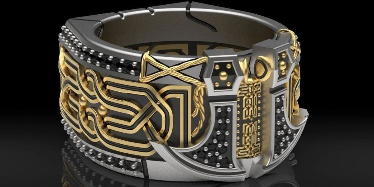 Finished gold and silver ring with patterned inlay work